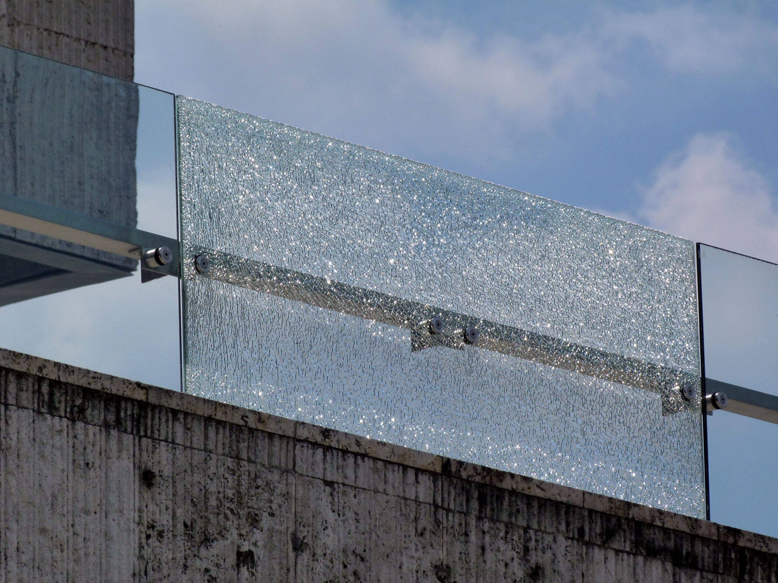 Shattered glass panel in balustrade